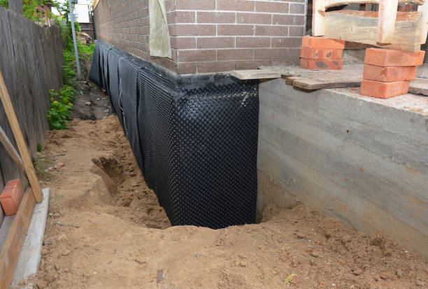 SJ Waterproofing Pros technician performing targeted Interior Drainage System assessment in Vernon, AL